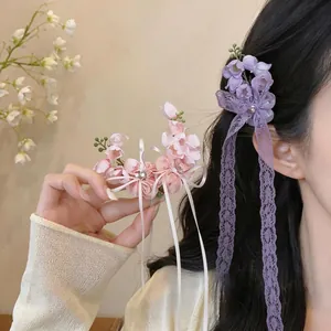 Elegant chiffon flower hair clip with sparkling rhinestones and long purple lace ribbons