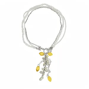 Multi-layer pearl necklace with yellow resin lemon charms and silver-tone OT clasp