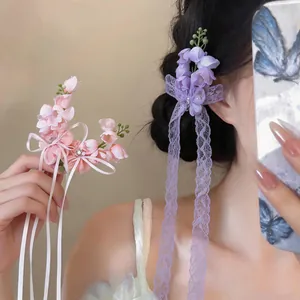 Exquisite chiffon flower hair clips featuring lace tassels and sparkly rhinestone centers