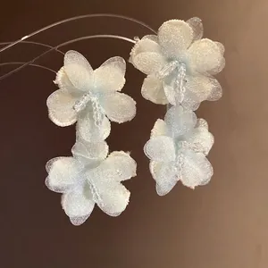 Elegant light blue mesh flower earrings for beach vacations with delicate bead centers