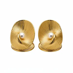 18k gold-plated textured oval stud earrings featuring an elegant central pearl.