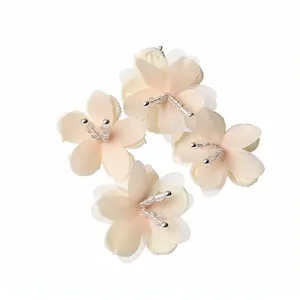 Elegant peach fabric flower stud earrings with beaded centers for seaside vacation style