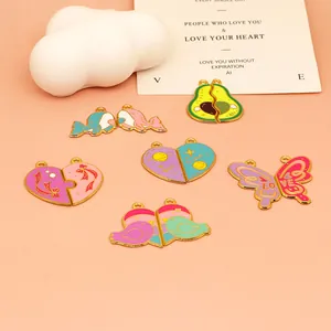 Detailed view of colorful enamel cartoon heart and animal pendants for DIY jewelry