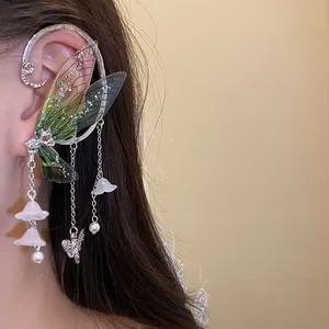 Ethereal resin butterfly wing ear cuff with delicate floral pendants and pearl accents