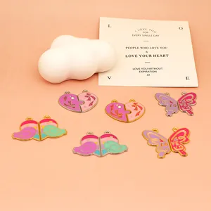 Detailed view of colorful DIY enamel heart and butterfly charms for custom jewelry making