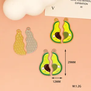 Detailed view of two-part avocado enamel pendants with 29mm height and 12mm width dimensions