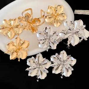 Vintage gold and silver metallic flower jewelry set with rings, earrings and cuff bracelet