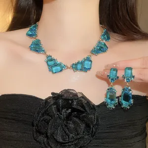 Detailed close-up of luxury retro palace style blue necklace and earring jewelry set