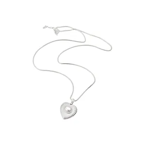 Elegant silver-tone heart necklace with a radiant textured pendant and a glossy center pearl