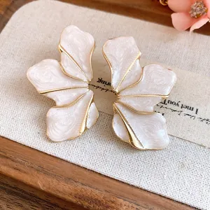 Elegant vintage flower stud earrings with pearlescent white enamel and gold alloy finish