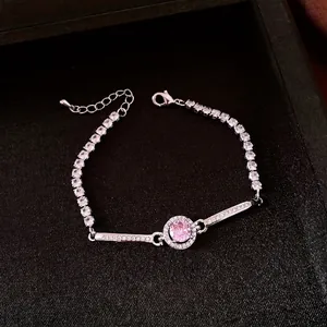 Elegante bracciale retrò tonalità argento con zircone rosa centrale e accenti di pavé