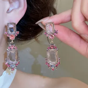 Elegant vintage court style geometric crystal drop earrings featuring pink rhinestones
