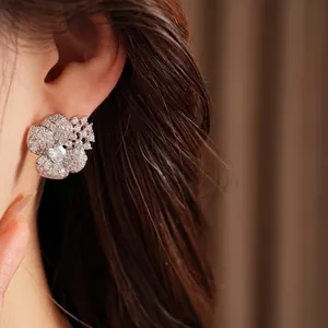 Elegant silver needle zircon flower stud earrings for women with luxury jewelry design