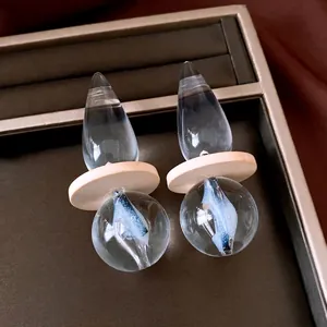 Vintage minimalist transparent teardrop earrings with artistic blue internal design