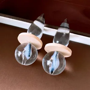 Retro transparent droplet earrings with wooden disc and blue internal swirl sphere