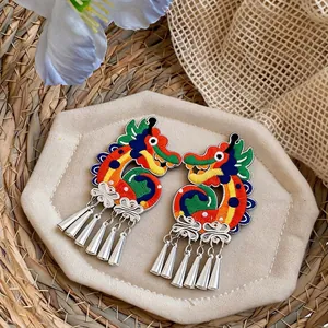 Ethnic style knitted dragon earrings with colorful embroidery and silver tassel design