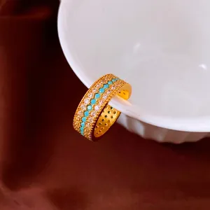 Vintage gold-plated ring with shimmering zircons and turquoise-colored beads