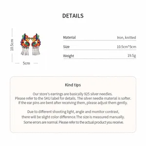 Detailed view of folk style knitted dragon earrings with tassel measurements and specifications
