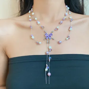 Elegante doppellagige Perlen- und Kristallkette mit lila Schmetterlingsquaste
