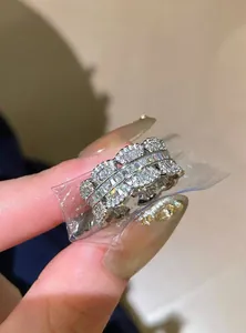 Close-up view of a silver-toned zircon ring with sparkling baguette stones.