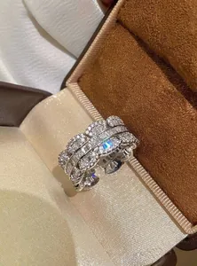 Close-up of elegant wide band zircon ring with sparkling baguette stones
