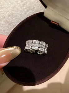 Close-up macro detail of an elegant zircon encrusted ring inside a brown velvet gift box