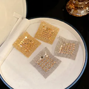 Exaggerated geometric metal sequin mesh tassel earrings in gold and silver finish
