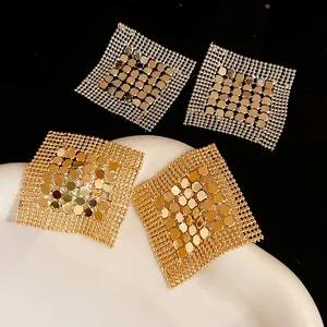 Stylish geometric sequin fringe earrings in gold and silver finishes, fashion jewelry set.