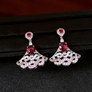 Elegant fan-shaped zircon drop earrings featuring red oval gemstones and luxury wavy design