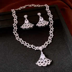 Elegant silver-tone jewelry set with oval zircon pendant and matching earrings.