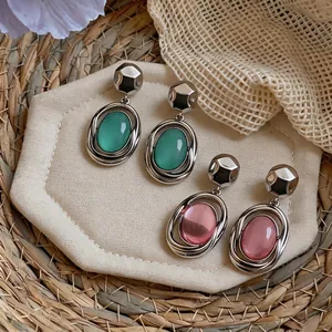 Korean style women's oval stone earrings in green and pink with silver geometric studs