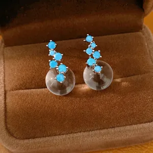 Elegant silver needle stud earrings with blue zircon cluster and clear resin sphere