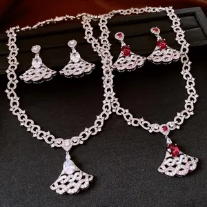 Detailed view of luxury silver-tone zircon necklace and earring sets with red and white stones.