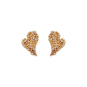 Exquisite 18k gold plated heart stud earrings featuring shimmering zircon stones on white background