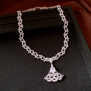 Detail view of luxury zircon necklace with fan-shaped pendant and oval stone center.