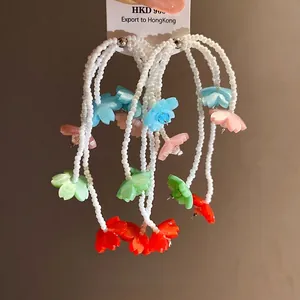 Resort style beaded earrings with colorful painted flower drops and silver needles