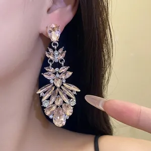 Elegant luxury silver needle chandelier earrings with sparkling teardrop crystal pendants