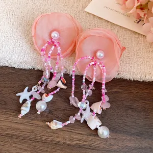 Elegant pink fabric flower tassel earrings with sea shell and starfish charms for summer