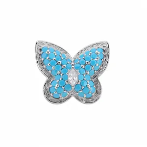 Elegant butterfly ear clip featuring blue stones and clear zircon in a silver finish