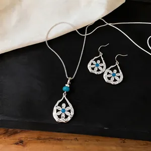 Elegant silver hollow flower waterdrop pendant necklace and drop earrings jewelry set for women