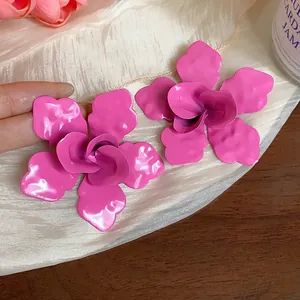 Statement oversized magenta enamel flower stud earrings for a bold and trendy fashion look