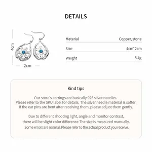 Product details for hollow teardrop earrings with flower pattern and blue stone