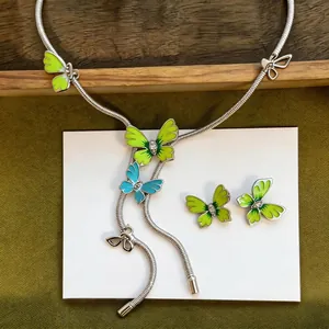 Elegant forest style butterfly jewelry set featuring green enamel and sparkling rhinestones