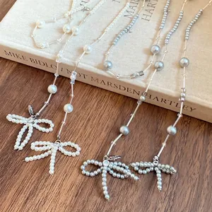 Elegante Künstliche Perle Gekralde Halskette Mit Schleife Anhänger Strass Kupfer Edelstahl Schmuck Für Damen