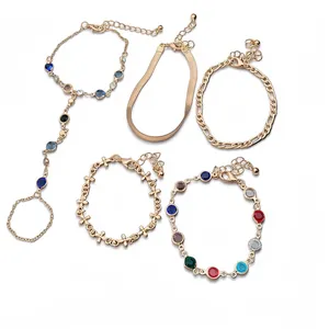 Elegant 5-piece gold chain bracelet set with colorful crystals and a hand harness ring