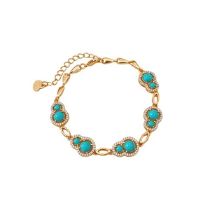 Elegant 18k gold plated bracelet featuring zircon accents and turquoise-color calabash charms