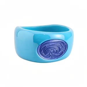 Elegant chunky blue resin bangle featuring a purple textured oval inlay for a luxury look