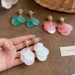 Elegant cat eye style tassel earrings with overlapping circular discs in multiple colors