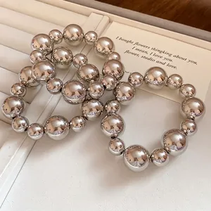 Elegant set of 3 silver polished round beaded bracelets with varied spherical bead sizes