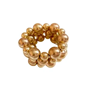 Elegant gold beaded elastic bracelet with varying sizes of smooth metallic spheres